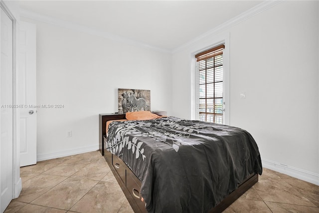 bedroom featuring crown molding and light tile patterned floors