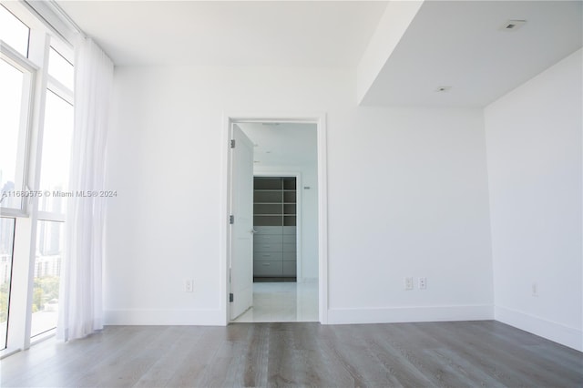 spare room featuring wood-type flooring