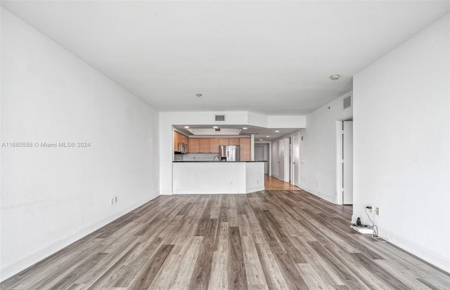 unfurnished living room featuring light hardwood / wood-style floors