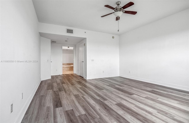 spare room with light hardwood / wood-style flooring and ceiling fan