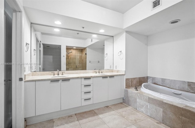 bathroom featuring vanity, tile patterned floors, and independent shower and bath