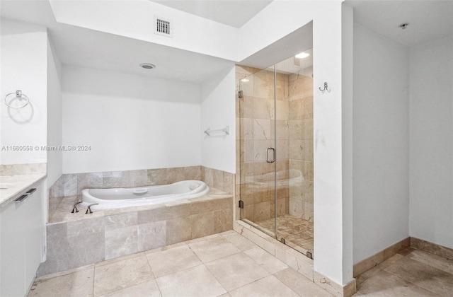 bathroom with vanity, plus walk in shower, and tile patterned flooring