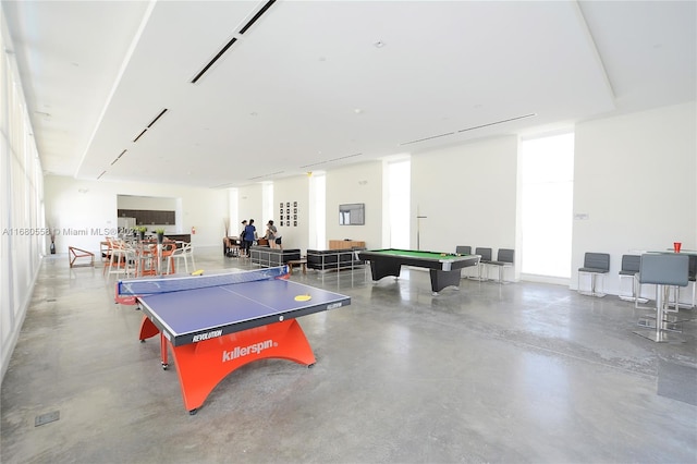 rec room with billiards and concrete floors