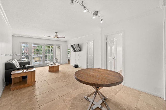 tiled living room with ornamental molding and ceiling fan