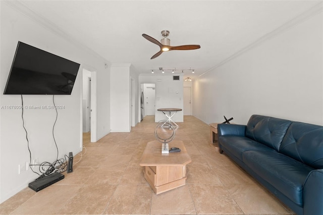 tiled living room featuring crown molding, track lighting, and ceiling fan