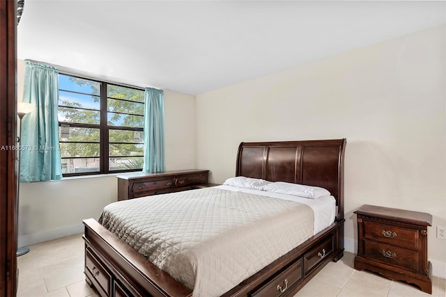 bedroom featuring light tile patterned floors