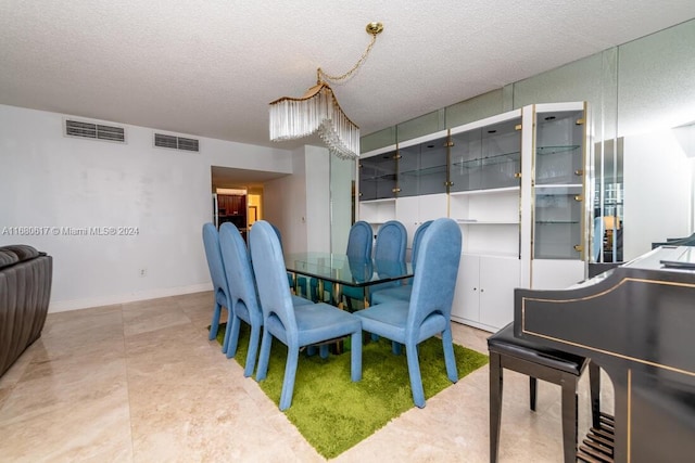 dining space with a textured ceiling