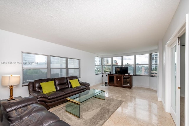 living room with a textured ceiling