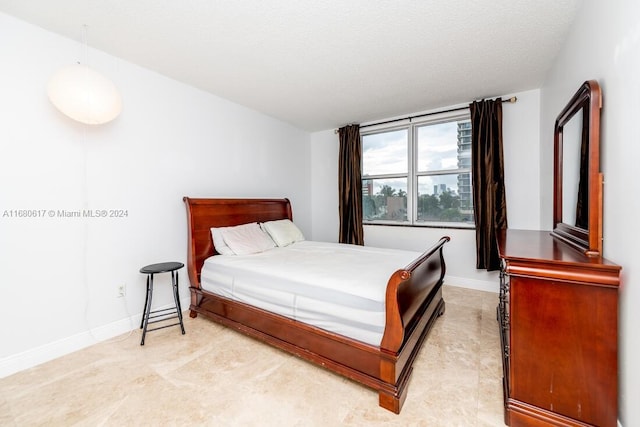 bedroom featuring a textured ceiling