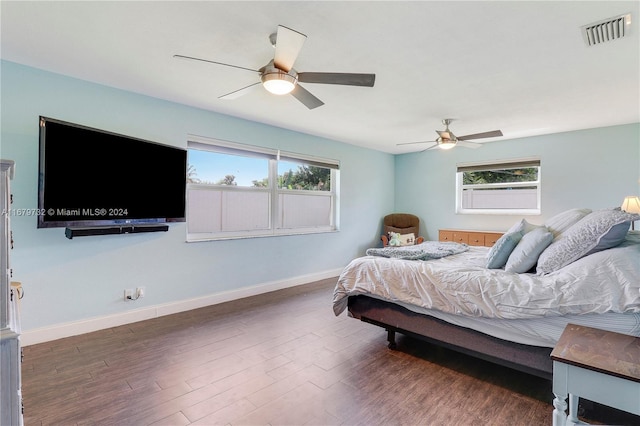 bedroom with dark wood-type flooring and ceiling fan