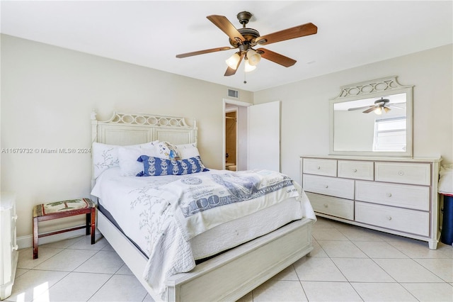 tiled bedroom with ceiling fan