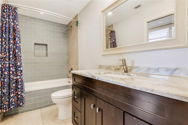 full bathroom featuring vanity, toilet, tile patterned floors, and shower / tub combo with curtain