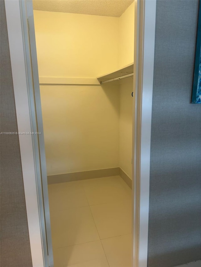 walk in closet featuring tile patterned floors