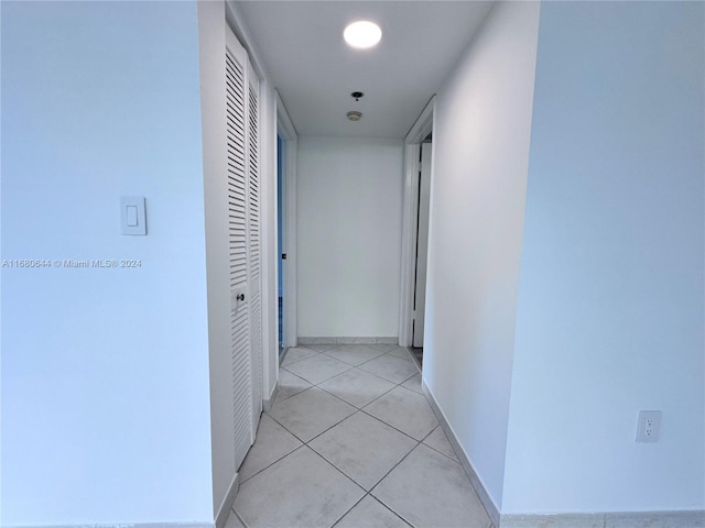 hallway with light tile patterned floors