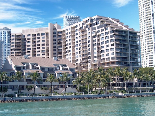 view of building exterior with a water view