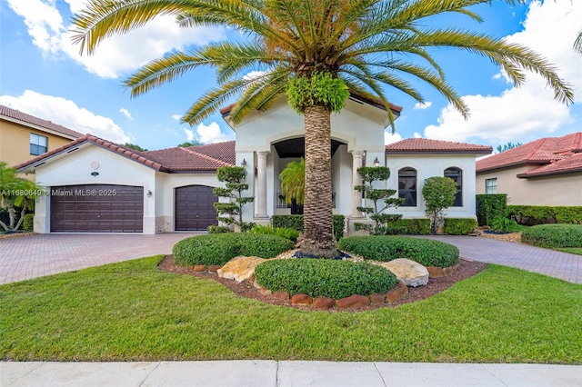 2294 SW 195th Ave, Miramar, FL 33029 - mediterranean / spanish home featuring stucco siding, decorative driveway, a garage, a tile roof, and a front lawn