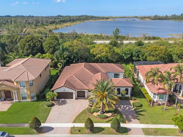 birds eye view of property with a water view