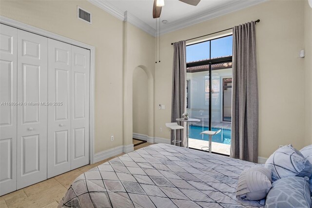 2294 SW 195th Ave, Miramar, FL 33029 - bedroom featuring access to exterior, ornamental molding, a closet, a ceiling fan, and arched walkways