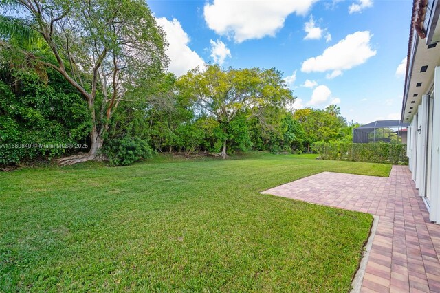 2294 SW 195th Ave, Miramar, FL 33029 - view of green lawn featuring a patio area