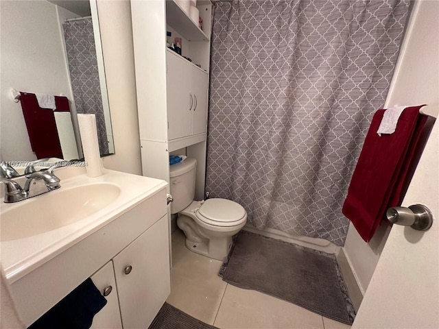 bathroom with vanity, toilet, tile patterned floors, and a shower with curtain