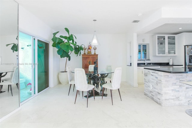 dining area featuring sink