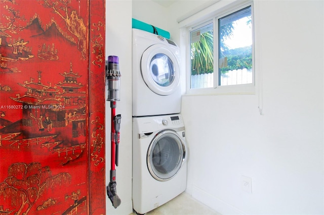 clothes washing area with stacked washer / drying machine