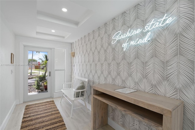 mudroom with a tray ceiling