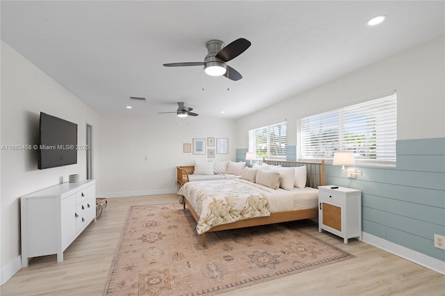 bedroom featuring light hardwood / wood-style flooring and ceiling fan