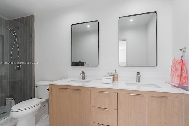 bathroom featuring vanity, toilet, and walk in shower