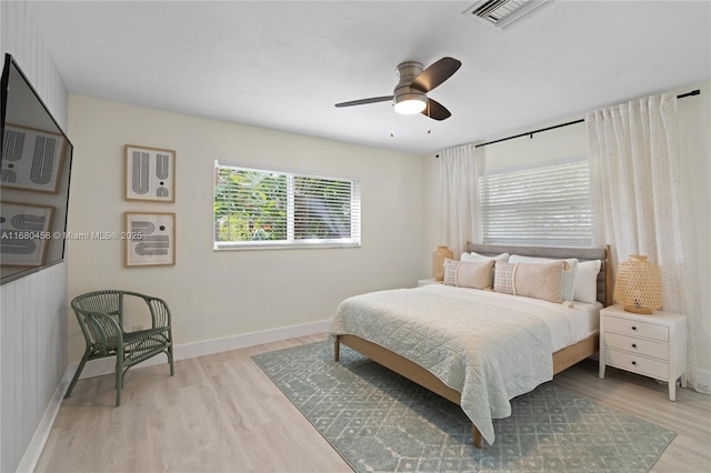 bedroom with ceiling fan and light wood-type flooring