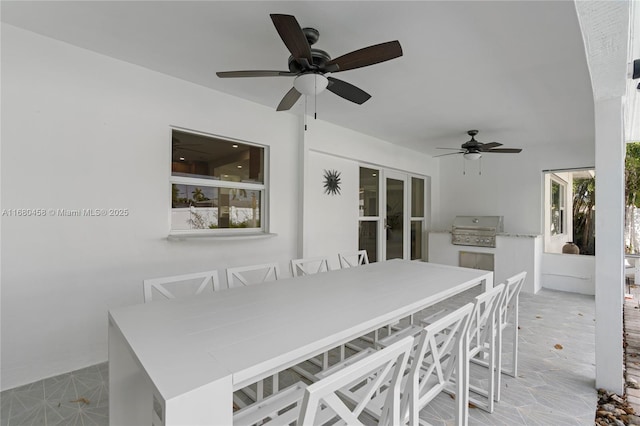 exterior space featuring ceiling fan