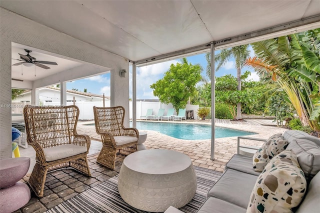 view of pool featuring ceiling fan and a patio area