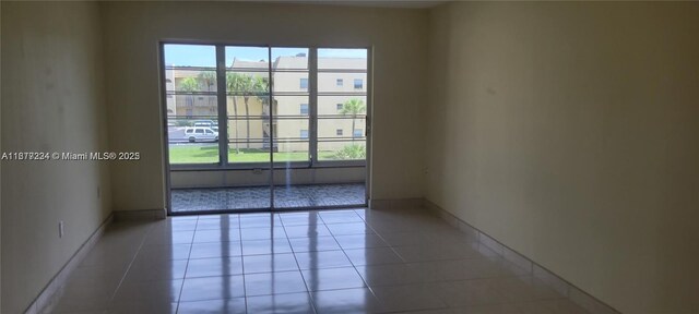 8285 Sunrise Lakes Blvd Unit 308, Sunrise, FL 33322 - unfurnished room with light tile patterned flooring and baseboards