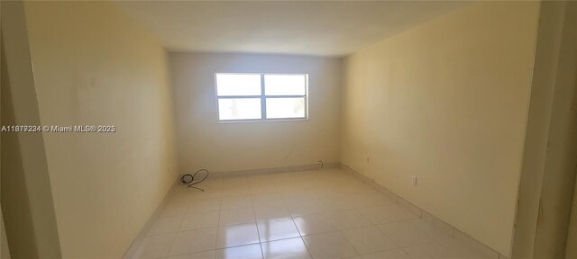 8285 Sunrise Lakes Blvd Unit 308, Sunrise, FL 33322 - kitchen with stainless steel appliances, dark countertops, white cabinets, and light tile patterned floors