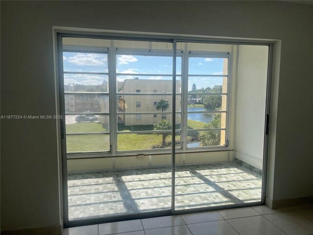 8285 Sunrise Lakes Blvd Unit 308, Sunrise, FL 33322 - entryway with a water view and tile patterned floors