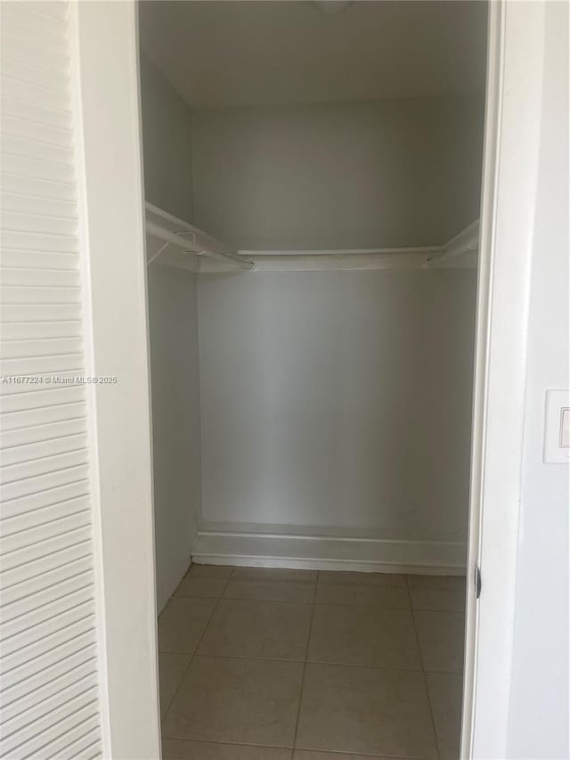 8285 Sunrise Lakes Blvd Unit 308, Sunrise, FL 33322 - walk in closet with tile patterned floors