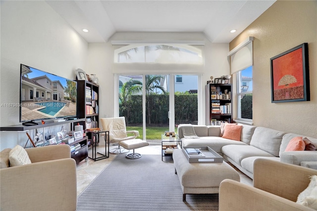 living room featuring vaulted ceiling