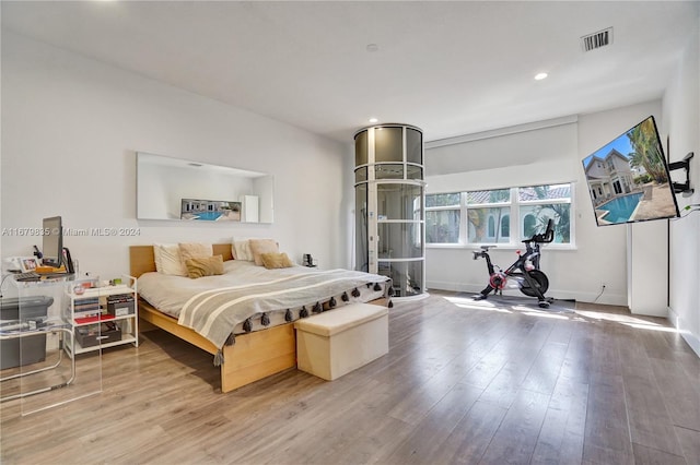 bedroom with hardwood / wood-style floors