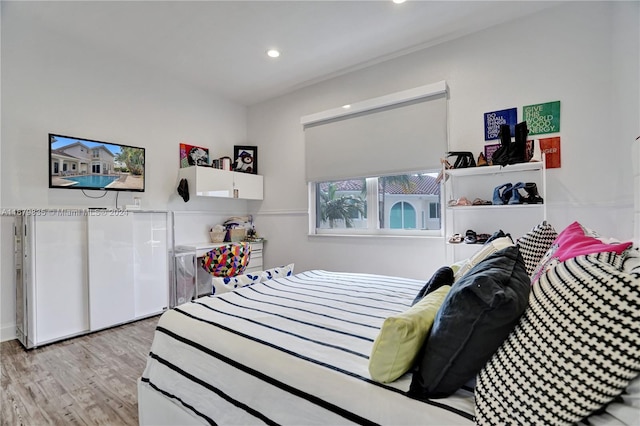 bedroom with light hardwood / wood-style flooring