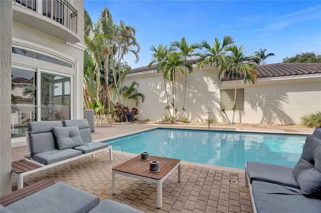 view of pool featuring a patio