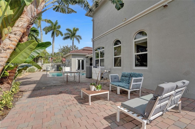 view of patio with a fenced in pool