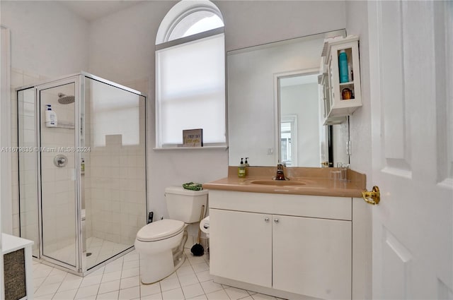 bathroom with walk in shower, vanity, toilet, and plenty of natural light