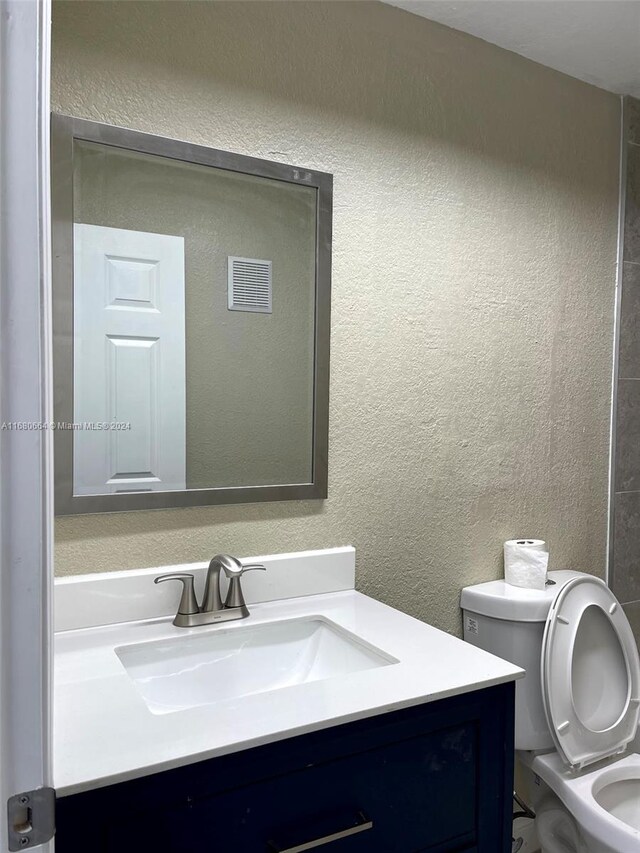 400 NW 65th Ave Unit 120, Margate, FL 33063 - bathroom with vanity and a textured wall