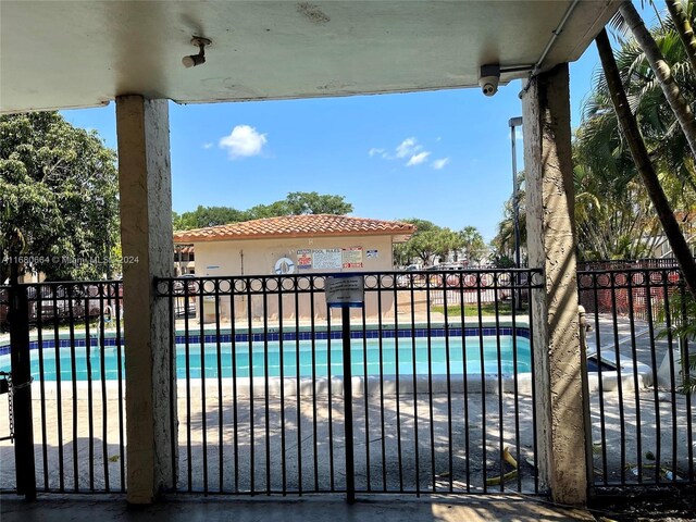 400 NW 65th Ave Unit 120, Margate, FL 33063 - gate featuring a community pool