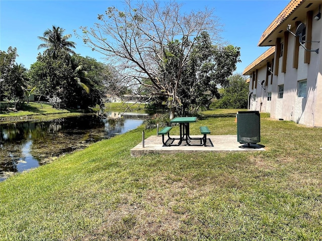 400 NW 65th Ave Unit 120, Margate, FL 33063 - view of green lawn with a water view and a patio