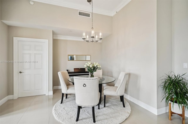 dining room featuring crown molding, a notable chandelier, and light tile patterned floors