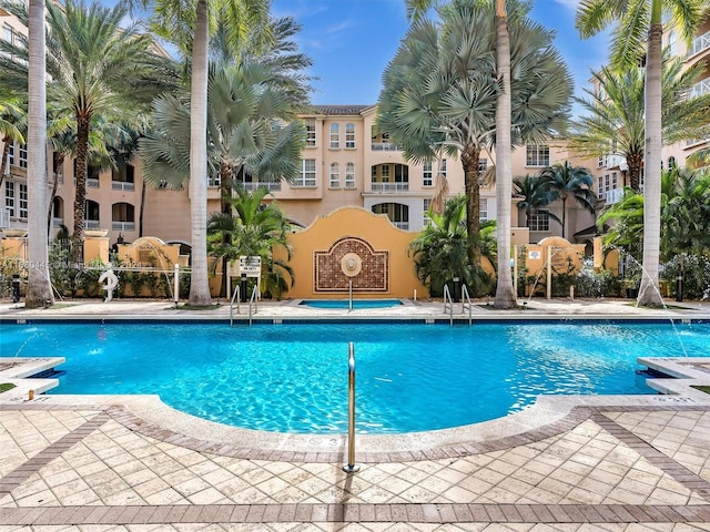 view of swimming pool featuring pool water feature