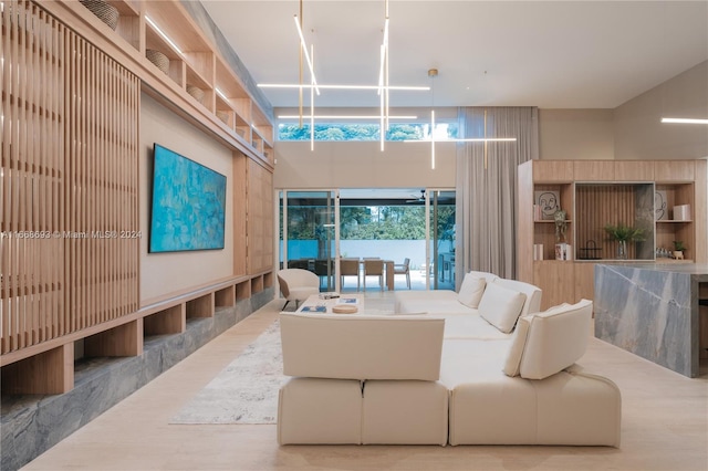 living room with a notable chandelier and hardwood / wood-style flooring