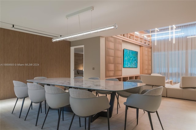 dining area with wooden walls