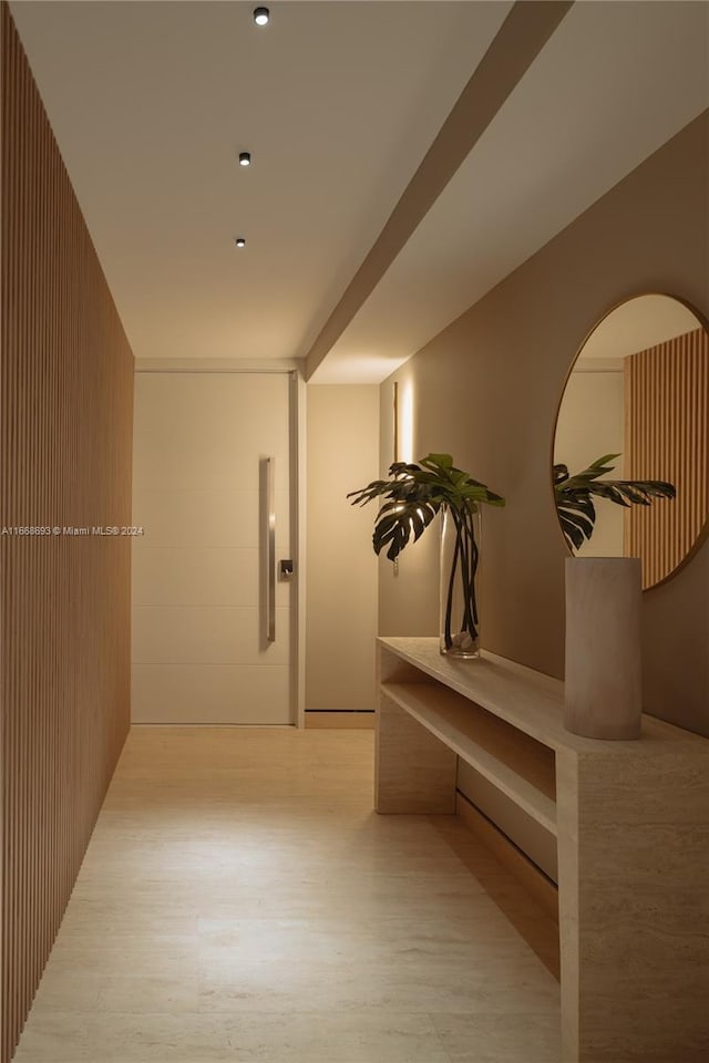 corridor with light hardwood / wood-style flooring